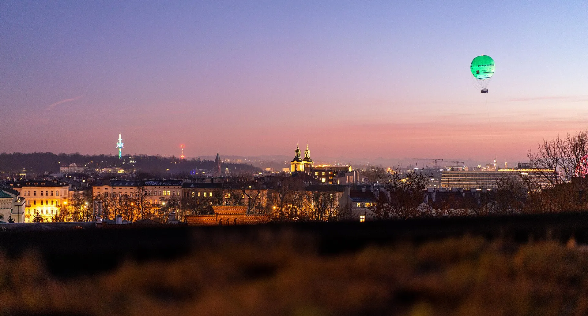 Kraków skyline at dusk with sightseeing balloon